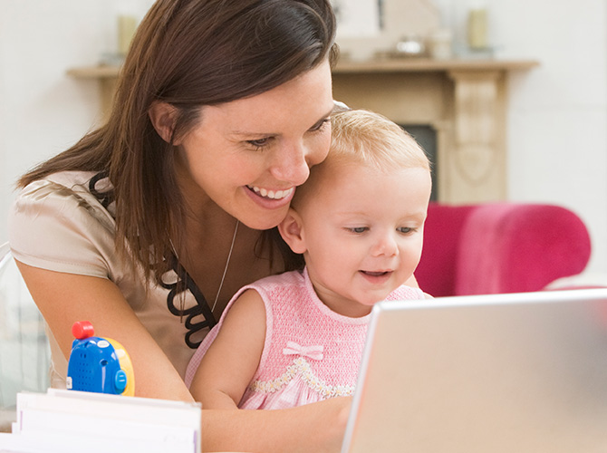 mom and baby on computer