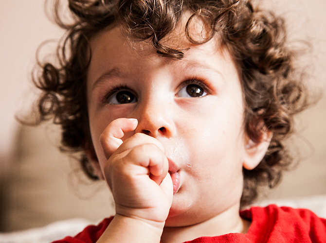 boy sucking thumb