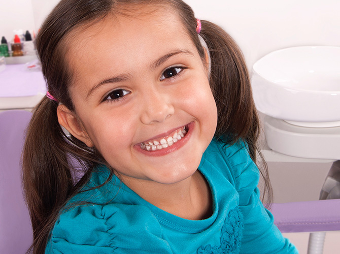 girl smiling at dentist