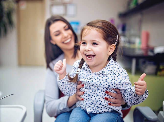 girl smiling at dentist