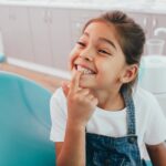 girl in dental chair to prevent cavities in kids