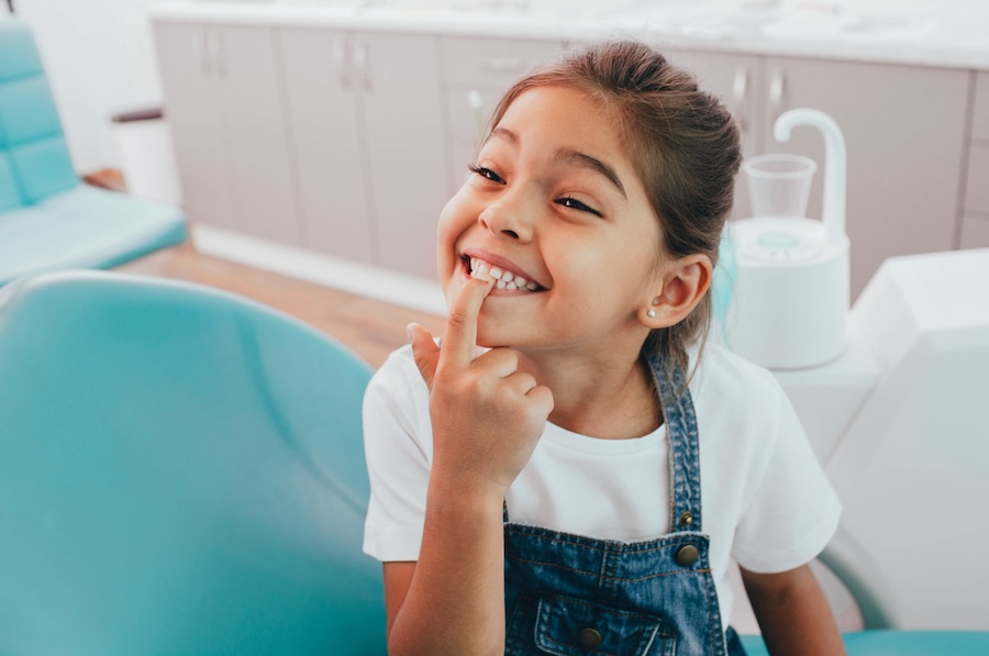 girl in dental chair to prevent cavities in kids
