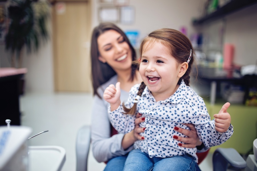 white spots on toddler teeth, mom with toddler at the dentist